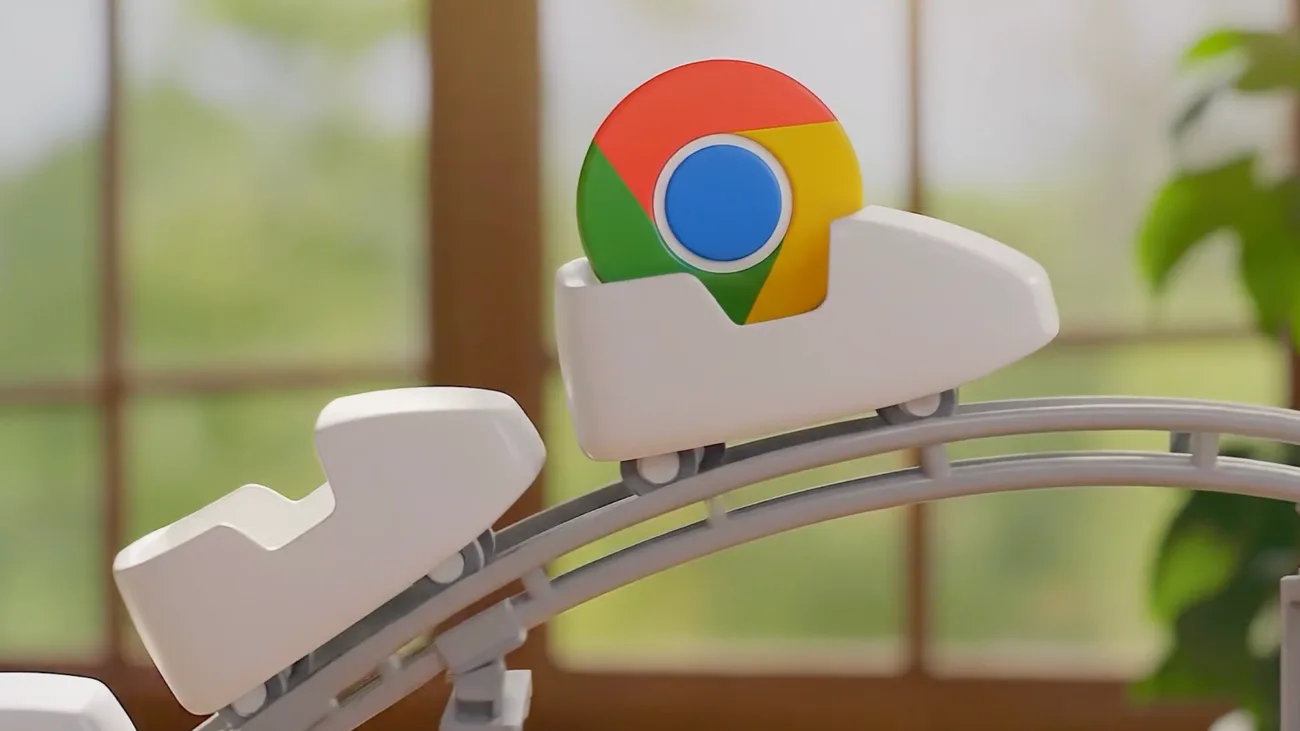 A 3D render of the Chrome logo riding a white cart along a rail, in a room with a window and a plant behind it.